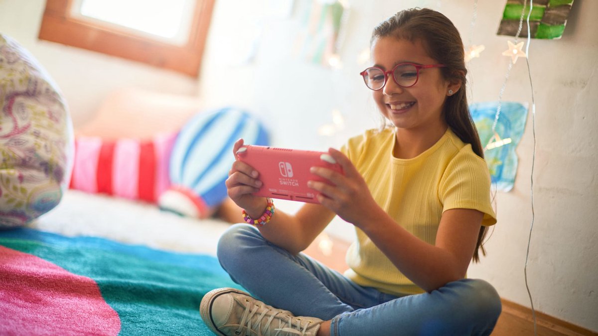 Nintendo Switch Lite Coral — handheld gaming console thumbnail 6