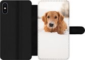 Bookcase Geschikt voor iPhone XS telefoonhoesje - Hond - Sneeuw - Winter - Met vakjes - Wallet case met magneetsluiting