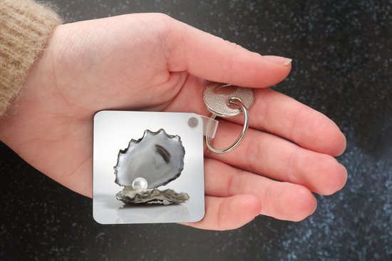 Porte-clés - Perle dans une huître - Plastique