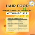 Garnier Fructis Hair Food, nouvelle formule enrichie en vitamines C, E, F. Contient un complexe nutritif et 0% de colorants ajoutés.