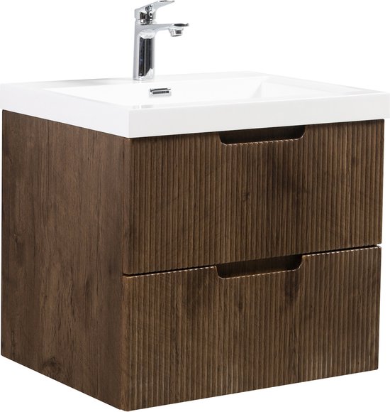 Meuble de salle de bain avec façades côtelées brun noyer, deux tiroirs, un lavabo blanc et un robinet chromé.
