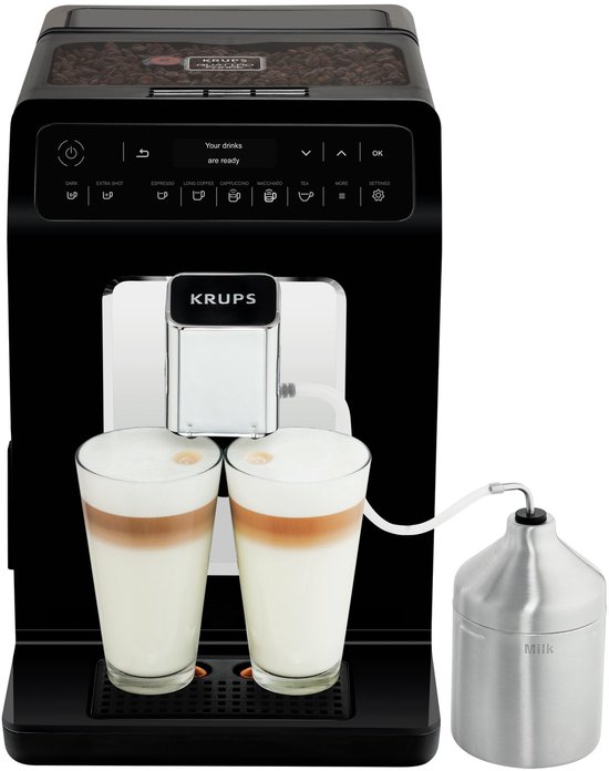 Zwarte Krups volautomatische espressomachine met twee glazen cappuccino en melkreservoir.