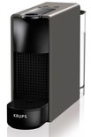 Grijze Krups Nespresso Essenza Mini koffiecupmachine met zwart rooster en waterreservoir.