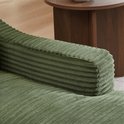 Detail van de groene corduroy stof van de armleuning van de fauteuil.