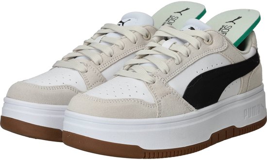 Puma Rebound Femme Low SD dames sneakers in wit, crème en zwart met bruine zolen en PUMA-logo.