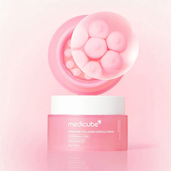 Medicube PDRN Pink Collagen Capsule Cream pot op deksel, met opengewerkt deksel dat roze capsules onthult.