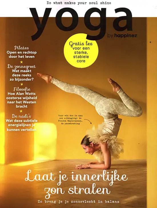 Vrouw in yogapositie op haar hoofd, met een witte kraag en een beige legging met print. 'Yoga by Happinez' magazine.