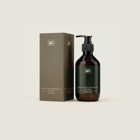 Bruine fles met pompdispenser en doos, beide met groene etiketten met 'MKBM CELLULITE CUPPING OIL WITH VITAMIN E'.