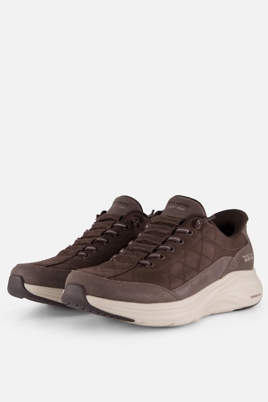 Bruine Skechers Slip-Ins sneakers met ritsluiting aan de zijkant en een gewatteerd patroon.