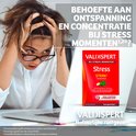 Vrouw met handen in haar, kijkend naar laptop, met Valdispert verpakking ernaast. Tekst: Behoefte aan ontspanning en concentratie.