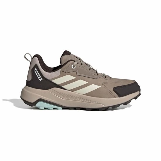 Bruine Terrex wandelschoen voor dames met witte strepen op de zijkant en donkere accenten.