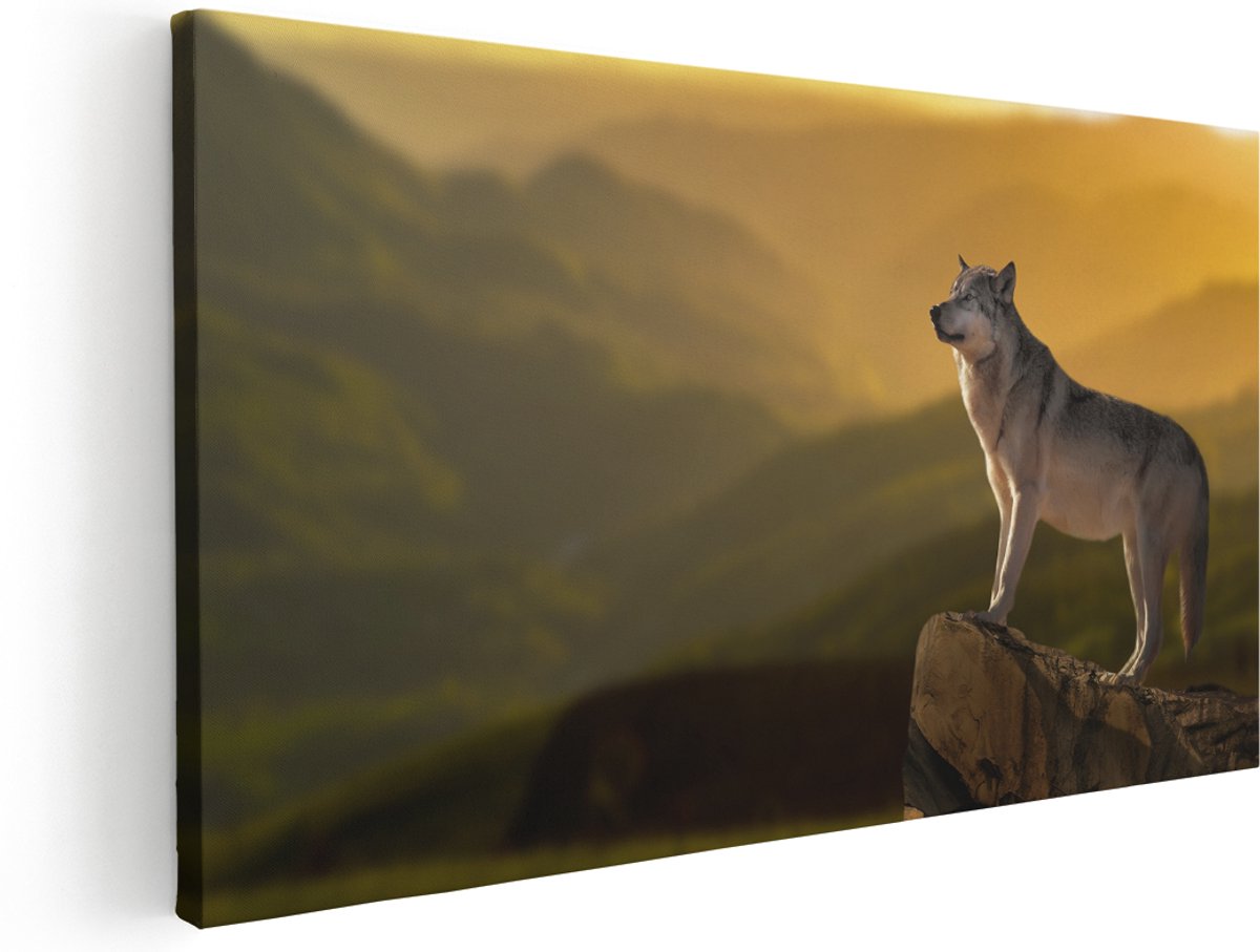 Artaza Canvas Schilderij Wolf Op Een Rots Met Een Heuvel Landschap - 180x90 cm - Groot - Wanddecoratie Woonkamer - Schilderijen - Muurdecoratie