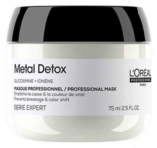Een witte pot met zwart deksel van L'Oréal Professionnel Metal Detox. Tekst: "Masque Professionnel / Professional Mask", "Prevents breakage & color shift."