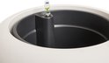 Bovenaanzicht van de binnenkant van een witte pot met watermeter.