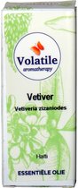 Doosje met 'Volatile aromatherapy Vetiver' essentiele olie uit Haiti. Groene tekeningen van bloemen en bladeren.