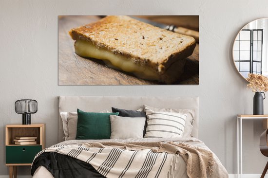 Canvas schilderij 160x80 cm - Wanddecoratie Tosti met gesmolten kaas op een snijplank - Muurdecoratie woonkamer - Slaapkamer decoratie - Kamer accessoires - Schilderijen