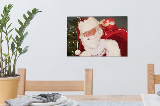 Un portrait du Père Noël portant un sac rouge sur son épaule toile 30x20 cm - petit - Tirage photo sur toile (Décoration murale salon / chambre)