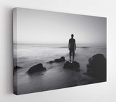 Canvas schilderij - Black and white seascape with alone man on the rocks  -     118099684 - 80*60 Horizontal