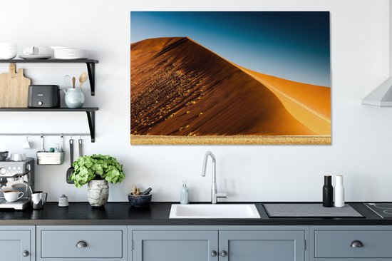 Les couleurs des dunes dorées sous le ciel bleu dans le parc du Namib-Naukluft Toile 140x90 cm - Tirage photo sur toile (Décoration murale salon / chambre)