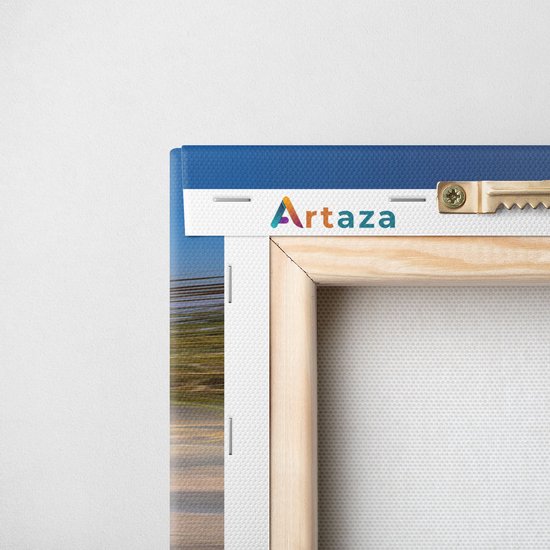Arrière d'une toile imprimée Artaza avec cadre en bois et système de suspension. Bordure avec ciel bleu.