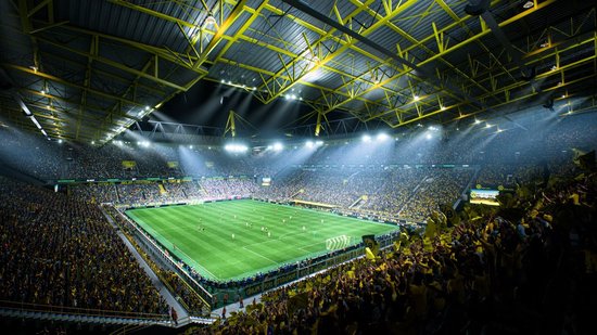 Grote voetbalstadion met veel gele accenten en een volle menigte.