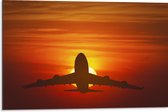 Dibond - Silhouet van Vliegtuig tegen Feloranje Zon in Roodkleurige Lucht - 75x50 cm Foto op Aluminium (Met Ophangsysteem)