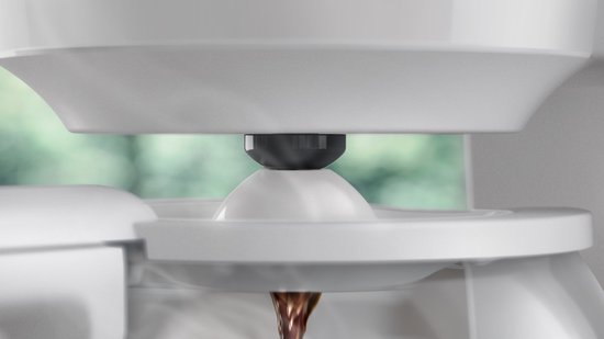 Gros plan du système anti-goutte d'une cafetière Philips blanche.