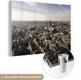 MuchoWow® Glasschilderij 30x20 cm - Schilderij acrylglas - Lucht - Delft - Architectuur - Foto op glas - Schilderijen
