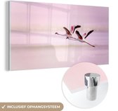 MuchoWow® Glasschilderij 160x80 cm - Schilderij acrylglas - Twee flamingo's tegen een roze lucht - Foto op glas - Schilderijen