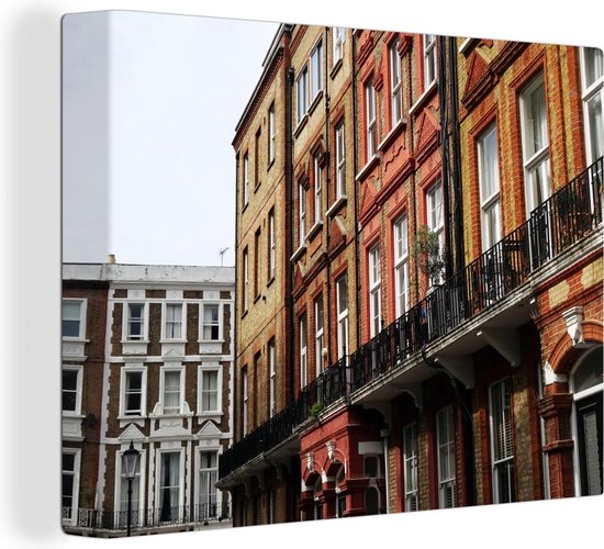 Vue de la façade avec balcons de plusieurs petites maisons Toile 40x30 cm - petite - Tirage photo sur toile (Décoration murale salon / chambre)