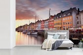 Papier peint Papier peint photo en vinyle - Le coucher de soleil à Nyhavn largeur 330 cm x hauteur 220 cm - Tirage photo sur papier peint (disponible en 7 tailles)