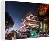 Canvas schilderij 140x90 cm - Wanddecoratie Drum Toren in Changsha verlicht in China - Muurdecoratie woonkamer - Slaapkamer decoratie - Kamer accessoires - Schilderijen