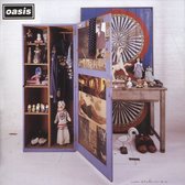 Oasis logo boven een open kast met kleding, speelgoed en schoenen. Darts en een tafel ernaast.