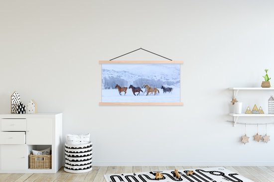 Affiche textielposter Troupeau de chevaux dans la neige 120x60 cm