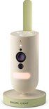Philips Avent babyfoon met camera, nachtlampje aan, op lichtgroene basis.