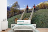 Behang - Fotobehang Alpen - Man - Alpenhoorn - Breedte 390 cm x hoogte 260 cm