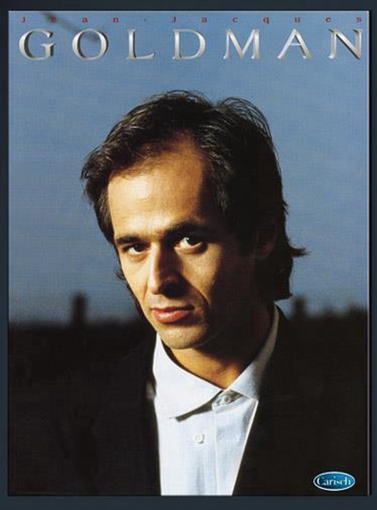 Jean-Jacques Goldman aux cheveux foncés, portant une veste noire et une chemise blanche. Texte : J A N - J A C Q U E S GOLDMAN.