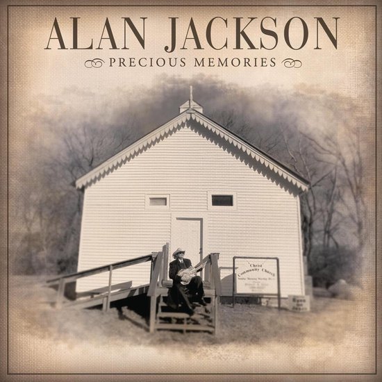 Alan Jackson 'Precious Memories' albumhoes met een man in cowboykleding zittend op de trap van een kerk, met een gitaar.