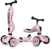 Roze 2-in-1 step/loopfiets combinatie. Voorzien van drie wielen en een zadel.