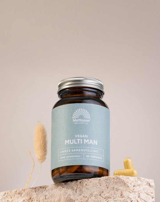 Bruine glazen pot met MATTISSON HEALTHSTYLE VEGAN MULTI MAN, met twee capsules ernaast.