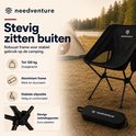 Zwarte campingstoel met robuust aluminium frame, geschikt tot 120 kg, met stevige verbindingspunten.