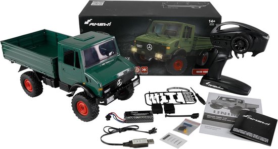 Groene Unimog 1300 L radiografisch bestuurbare truck, met afstandsbediening, accu en onderdelen.
