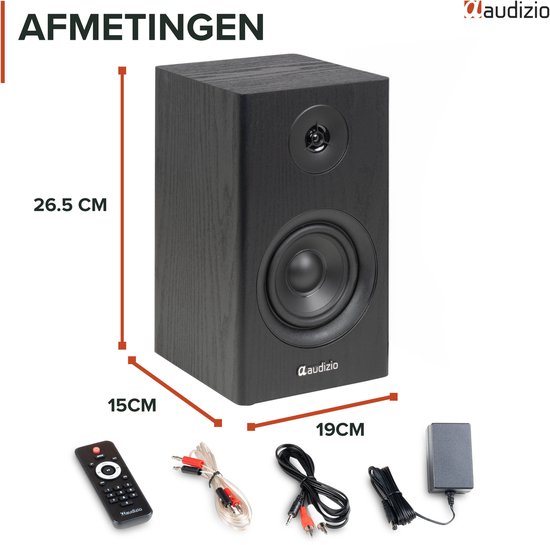 Zwarte boekenplank speaker met afmetingen 26.5x15x19cm, inclusief accessoires zoals afstandsbediening en kabels.