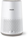 Witte Philips luchtreiniger met gedetailleerd patroon op de onderkant.
