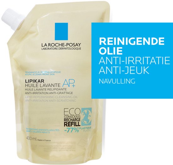 Gele navulzak met witte dop en blauw logo. Tekst "REINIGENDE OLIE ANTI-IRRITATIE ANTI-JEUK NAVULLING". 400 ml.