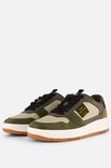 Paar PME Legend sneakers in beige, groen en bruin leer en suède, met witte zolen.