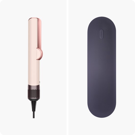 Een keramische roze/roségouden stijltang met een donkergrijze mat.