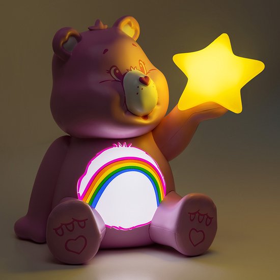 Veilleuse Cheer Bear rose avec un arc-en-ciel lumineux et une étoile jaune.