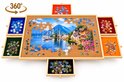 Puzzelbord met 6 gevulde lades en een compleet gelegde puzzel van een dorp aan het water.