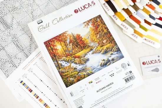 Inhoud van het Luca-S 'Autumn Haven' kruissteekpakket met patronen, garen en een voorbeeldafbeelding.